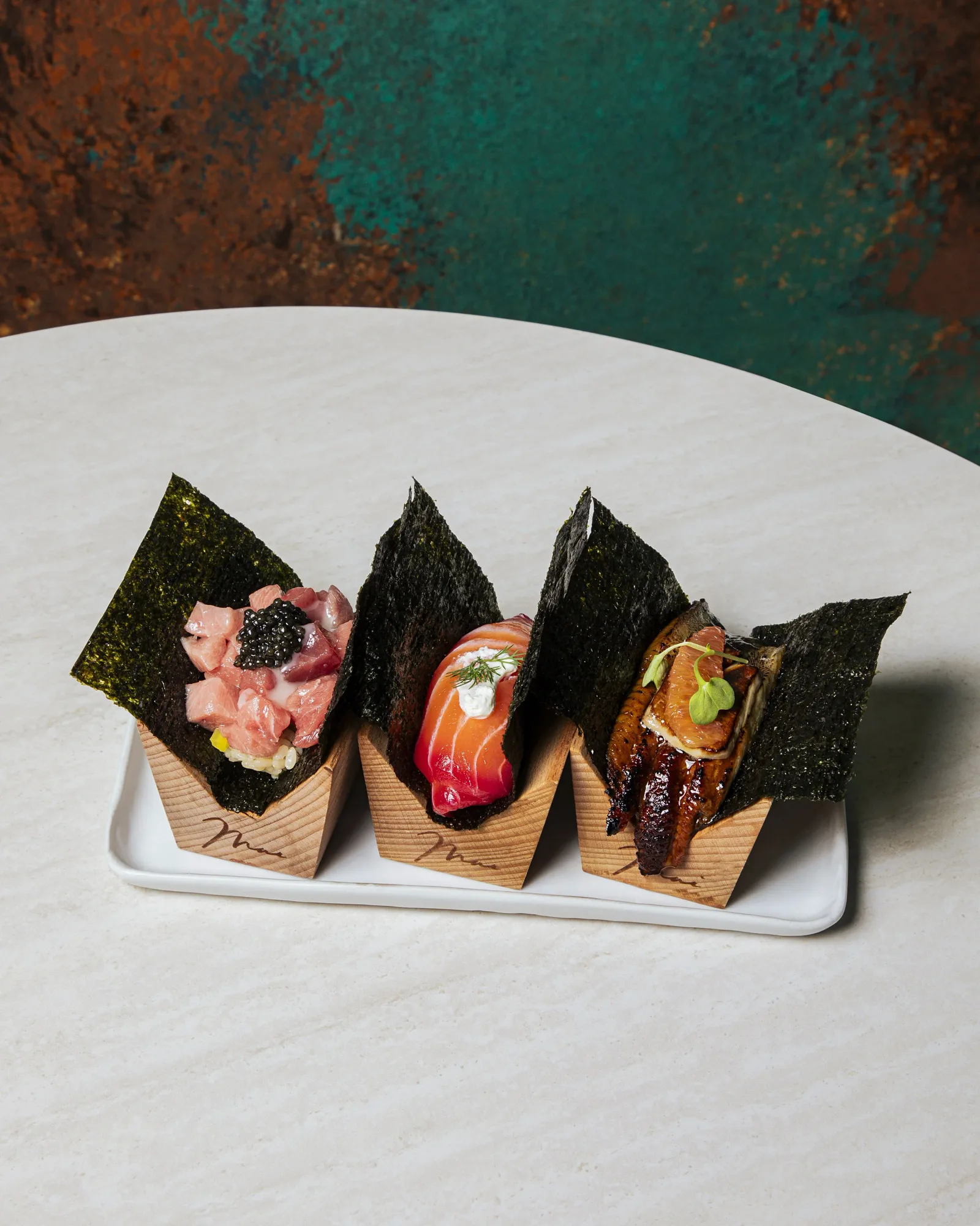 Handroll trio in cedar stands